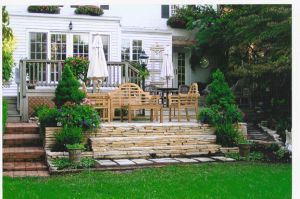 Goldenteak Teak Marlborough Lutyens Set and Teak Dining Set at an upscale Greenwich Connecticut home